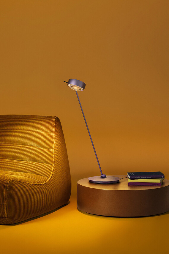 Occhio Sento tavolo table luminaire on yellow backround