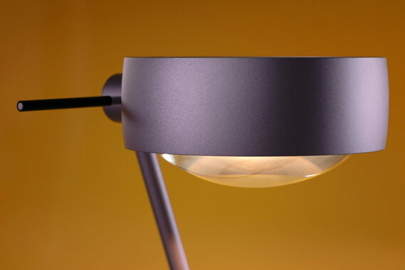 Occhio Sento tavolo table luminaire on yellow backround