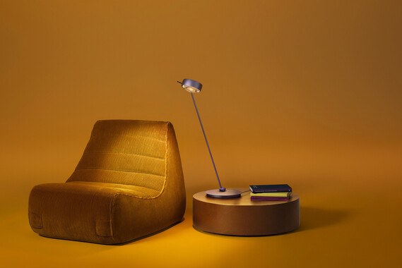 Occhio Sento tavolo table luminaire on yellow backround