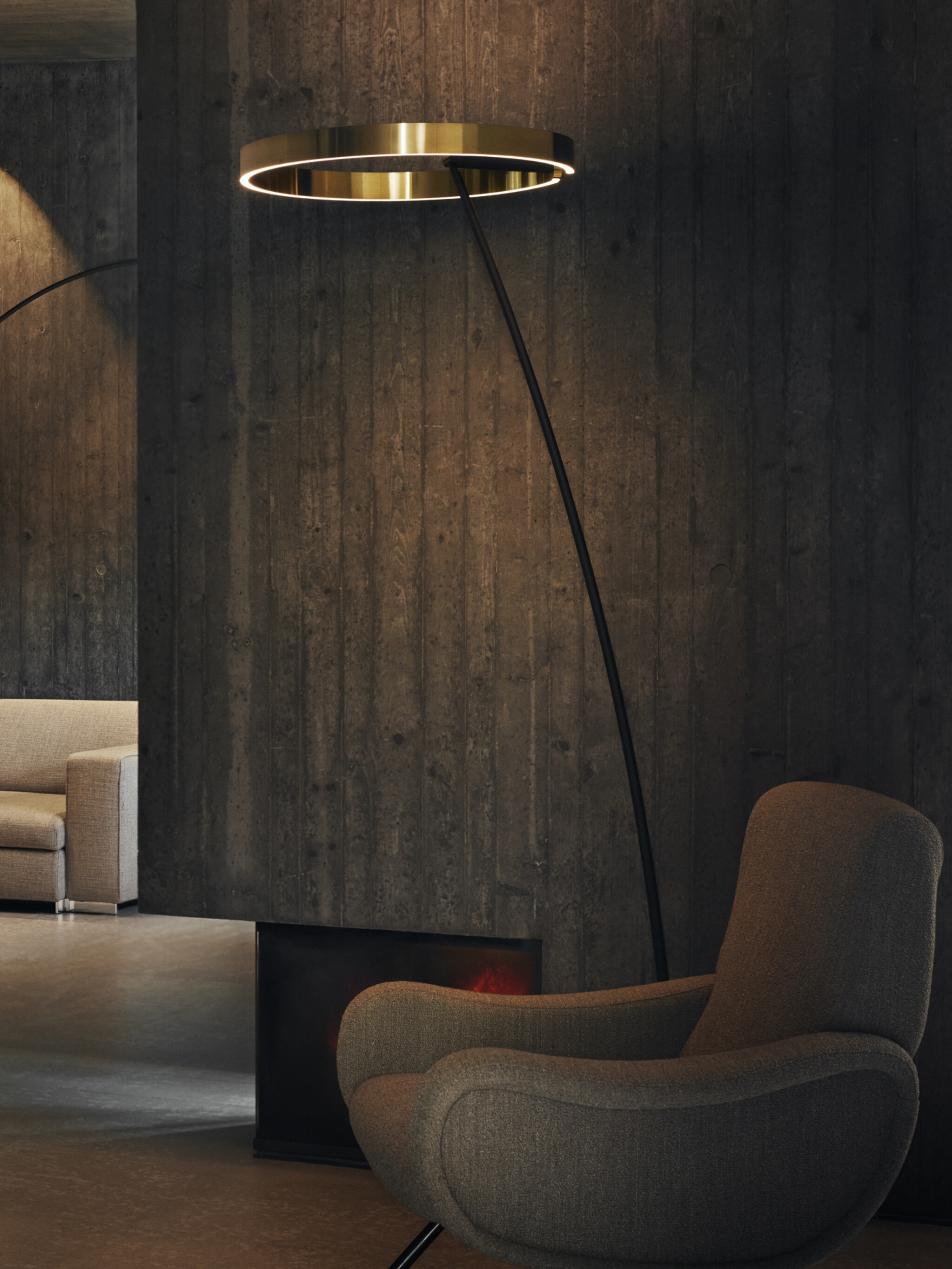 Mito raggio bronze floor luminaire in a concrete living room