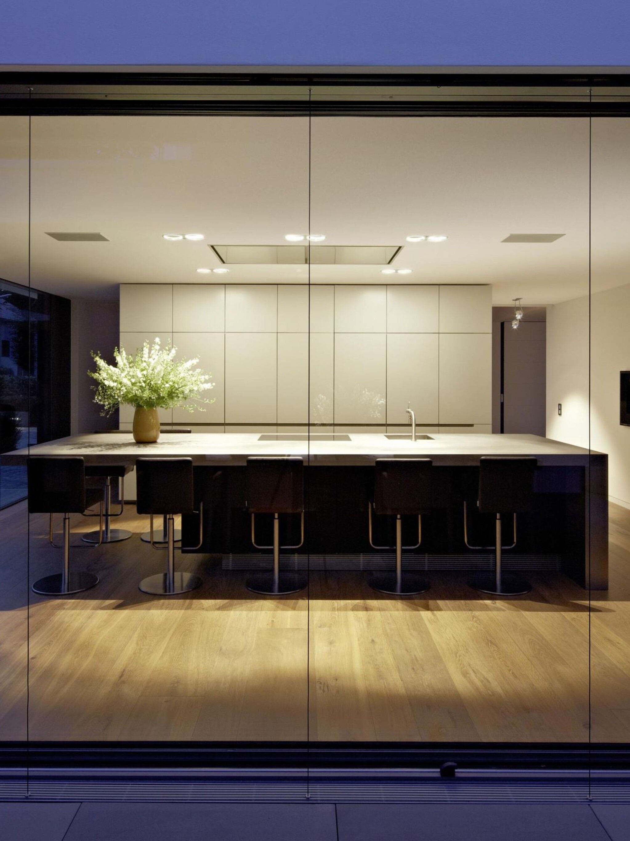 White ceiling spotlights providing uniform kitchen light