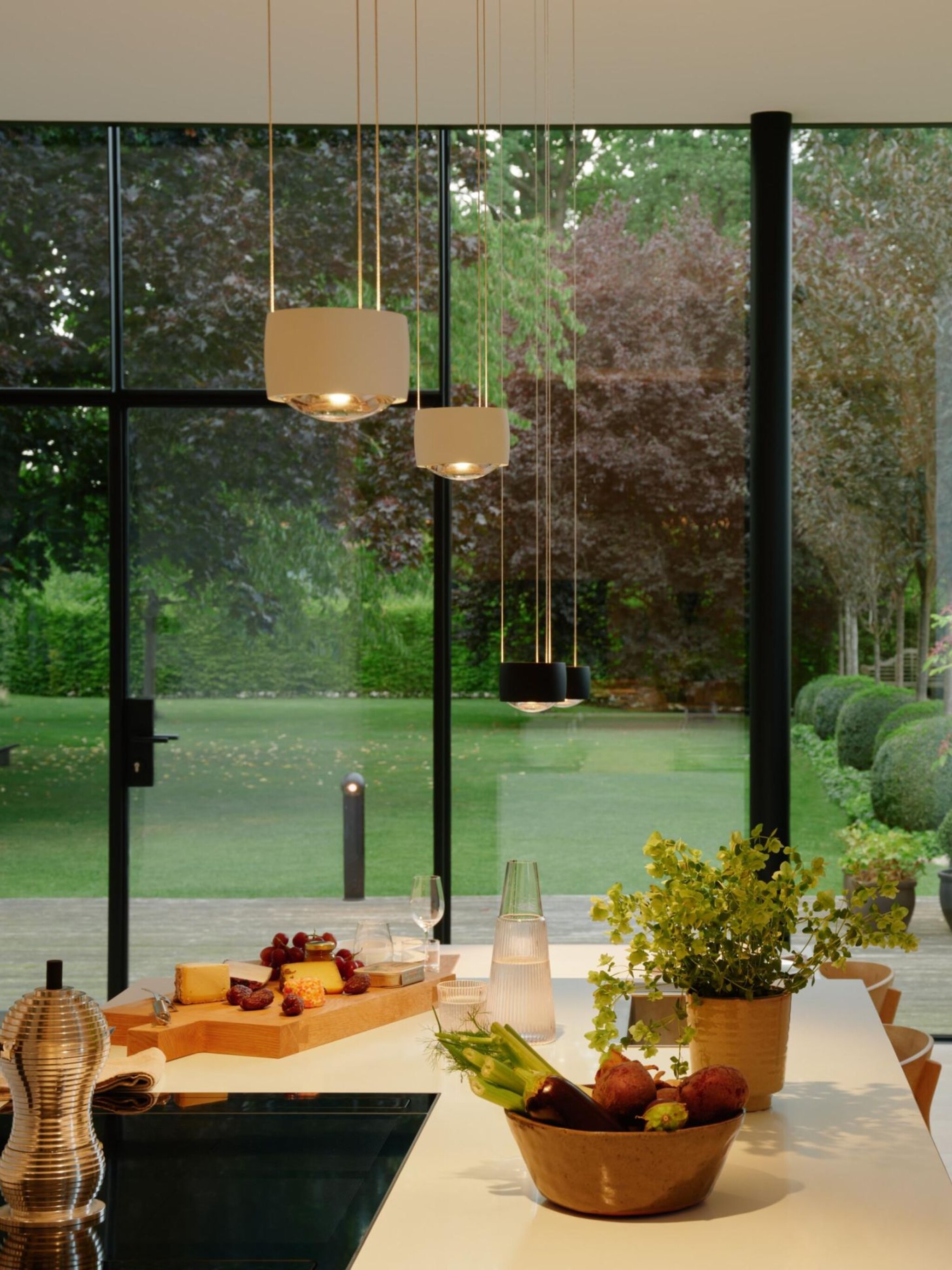 Sento sospeso white pendant above kitchen counter