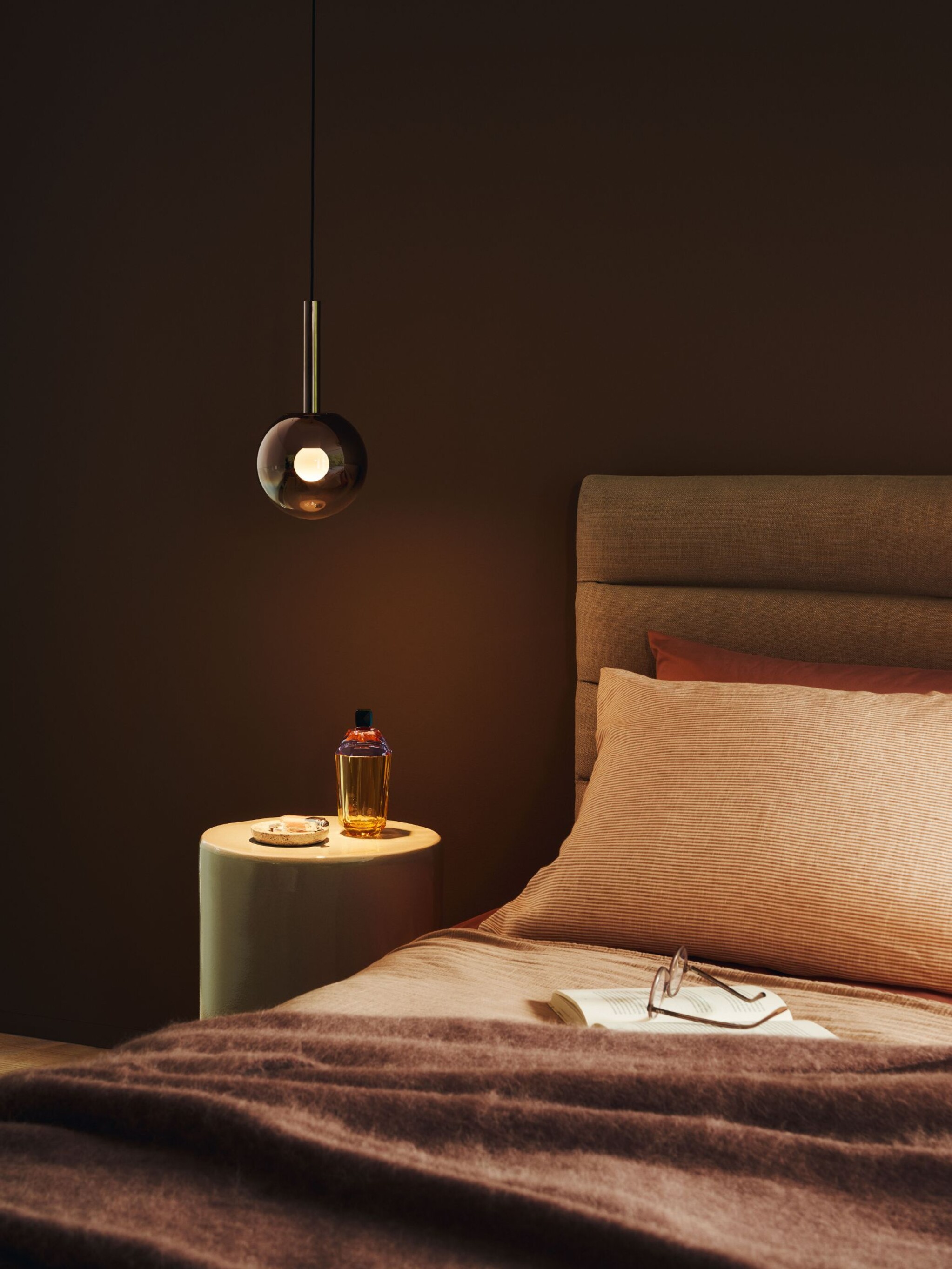 Luna sospeso pendant luminaire beside bed