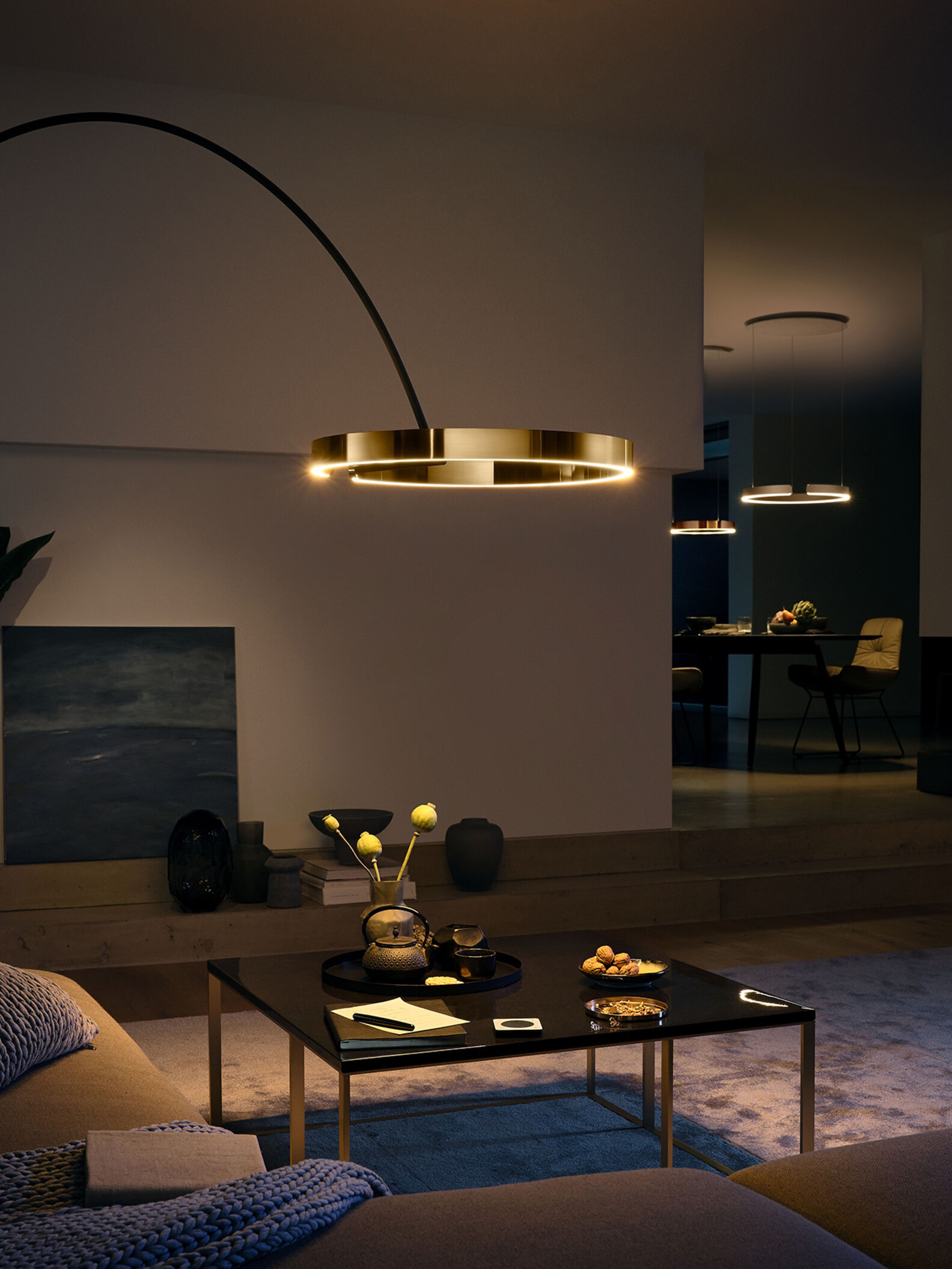 Occhio Mito largo bronze floor luminaire in warm living room setting - designer arc lamp in Dubai