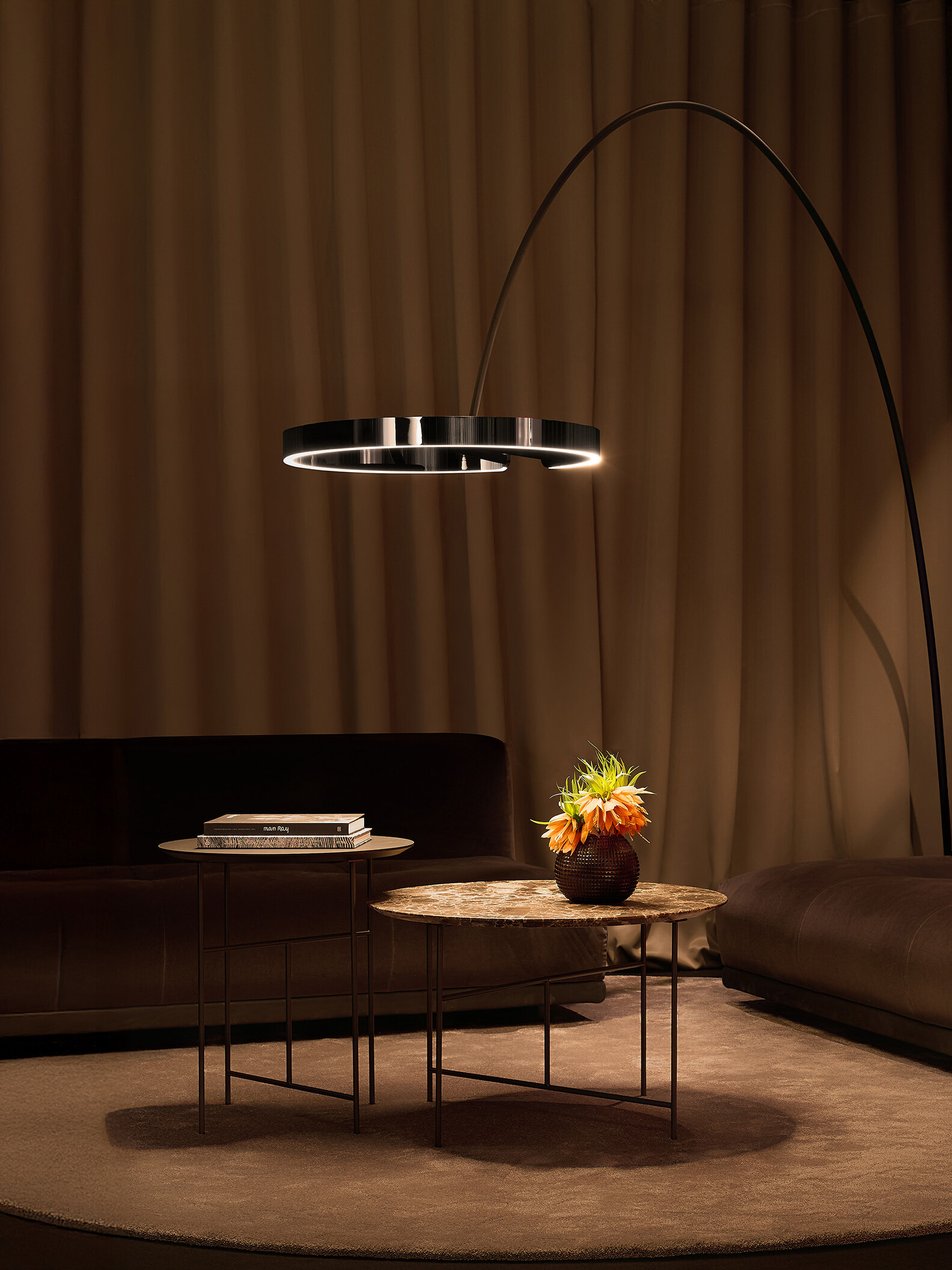 Occhio Mito largo dark chrome floor luminaire in luxury living room - designer arc lamp available at Goettling Interiors Dubai
