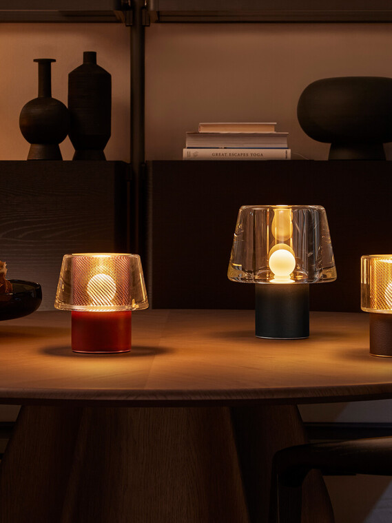 Occhio era and era lusso glass table luminaire metal mesh on dinner table
