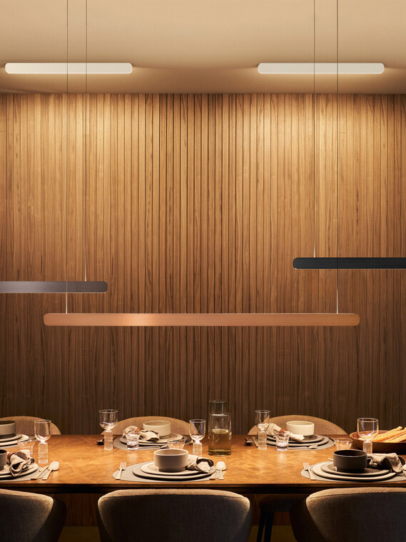 Occhio Mito volo pendant luminaires over dining table