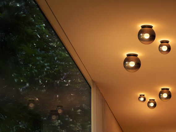 Occhio Luna piena Design LED glass ceiling luminaire illuminating hallway