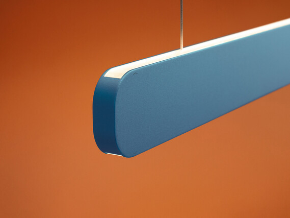 Occhio Mito volo pendant luminaire on orange background