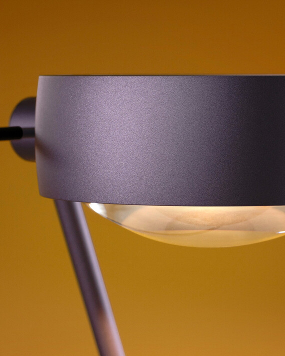 Occhio Sento tavolo table luminaire on yellow backround