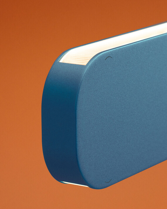 Occhio Mito volo pendant luminaire on orange backround close up